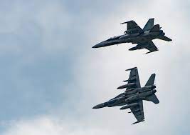 Two other CF-188 Hornet aircraft execute high speed manoeuvres at 4 Wing Cold Lake, during Exercise MAPLE FLAG 50 on 1 June 2017 (Credit: RCAF)