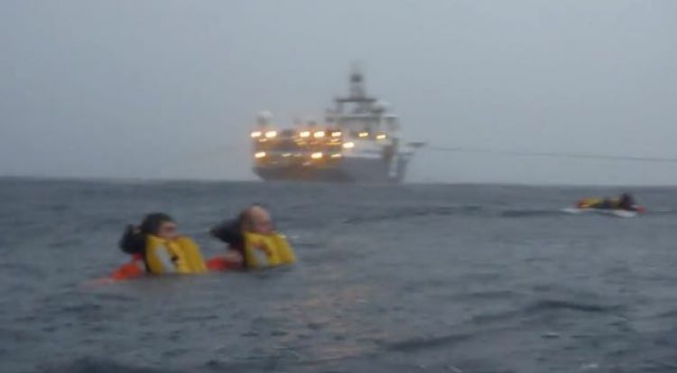 Survivors in the Water - Note the Streamer Tow Cables (Credit: Passenger Video)