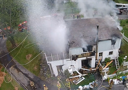 Firefighters Turn Hose on Drone (Credit: John Thompson)