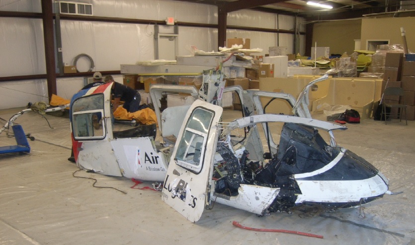 Wreckage of Rotorcraft leasing Company (RLC) B206L4 N180AL (Credit: NTSB)  Note: Decals over the name of the former owner have come loose after the exposure to sea water.
