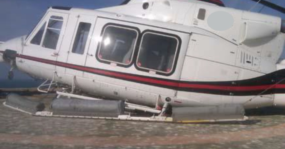 Bell 412EP A6-FLV on the Guano Contaminated PC03 Wellhead Helideck, Zakum Field, UAE (Credit: GCAA)