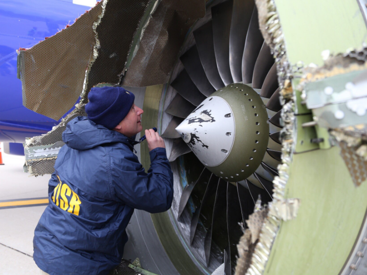 Investigators examine damage to Southwest B737-800 N772SW No 1 CFM56-7B Engine at Philadelphia (Credit: NTSB)