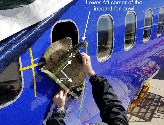 Picture of window 14 with portion of engine inboard fan cowl (Credit: NTSB)