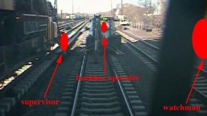 The view from the train's forward camera, approximately 0.5s before impact at over 100mph, with workers redacted by red symbols (Credit: NTSB)