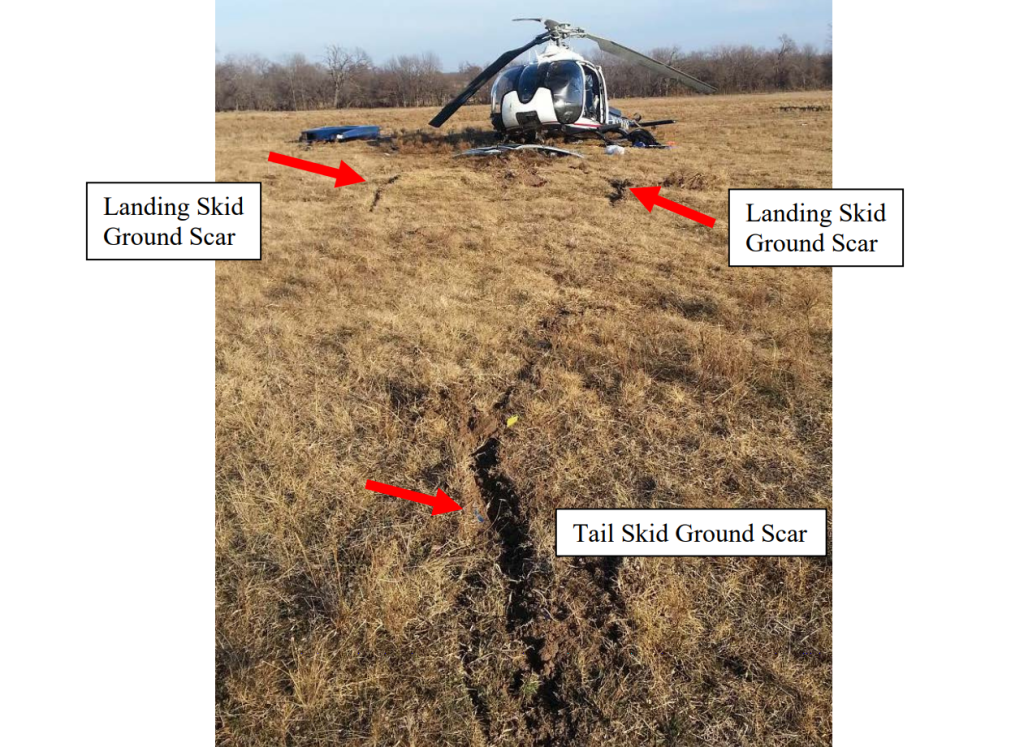 Wreckage of Air Methods EC130B4 HEMS Helicopter N334AM After Ice Ingestion and Power Loss Showing Ground Scars (Credit: NTSB)