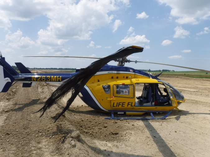 Metro Aviation HEMS Airbus Helicopters BK117C2 / H145 N263MH at Wayne County Airport (KBJJ), Wooster, Ohio After Hard Landing, Tangle in Silt Fencing (Credit: NTSB)