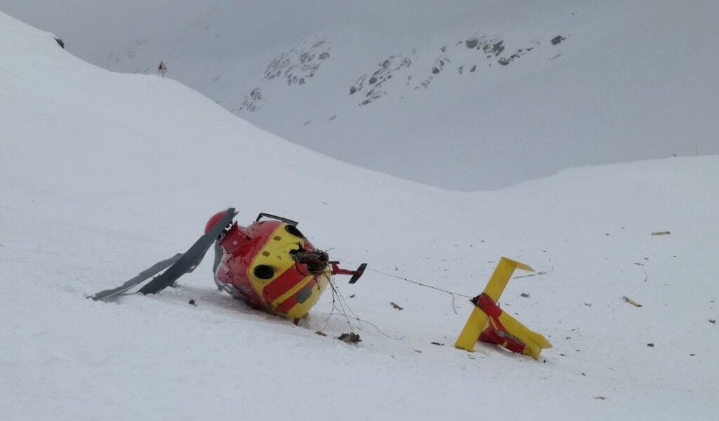 Wreckage of Air Glaciers Airbus Helicopters EC135T1 HB-ZIR at Col du Grand St-Bernard: The Road Sign Used for Visual Reference is Visible Top Left (Credit: SUST)
