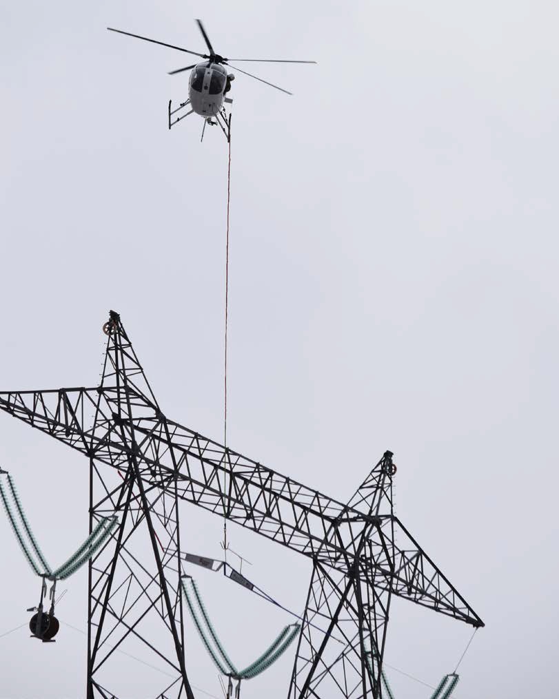 Rogers Helicopters MD 530F (369FF) N530KD Over an Electricity Pylon (Credit: via NTSB)